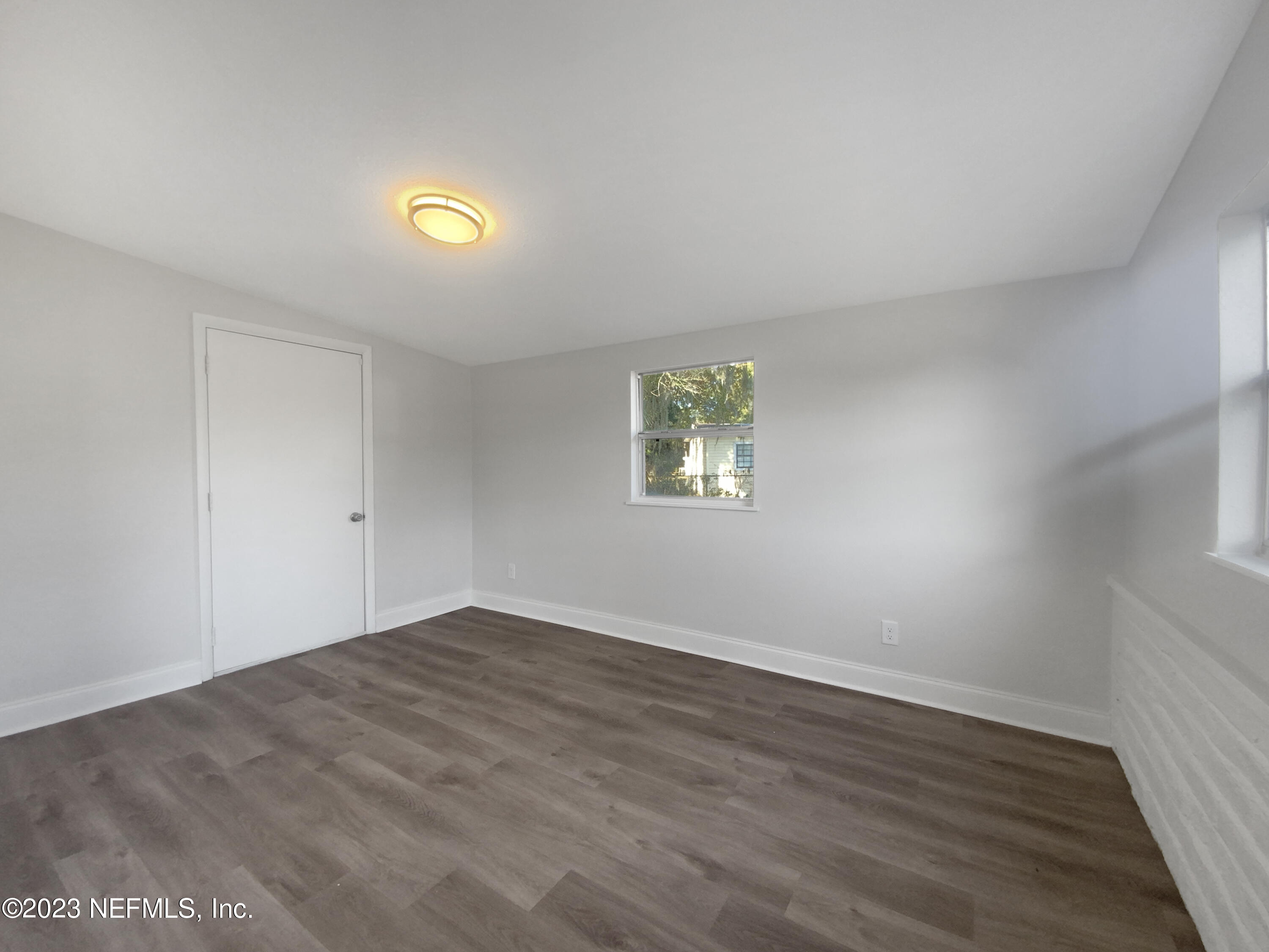 4204 Clyde Drive Jacksonville, FL 32208 - Photo 11 of 20 a view of an empty room with a window