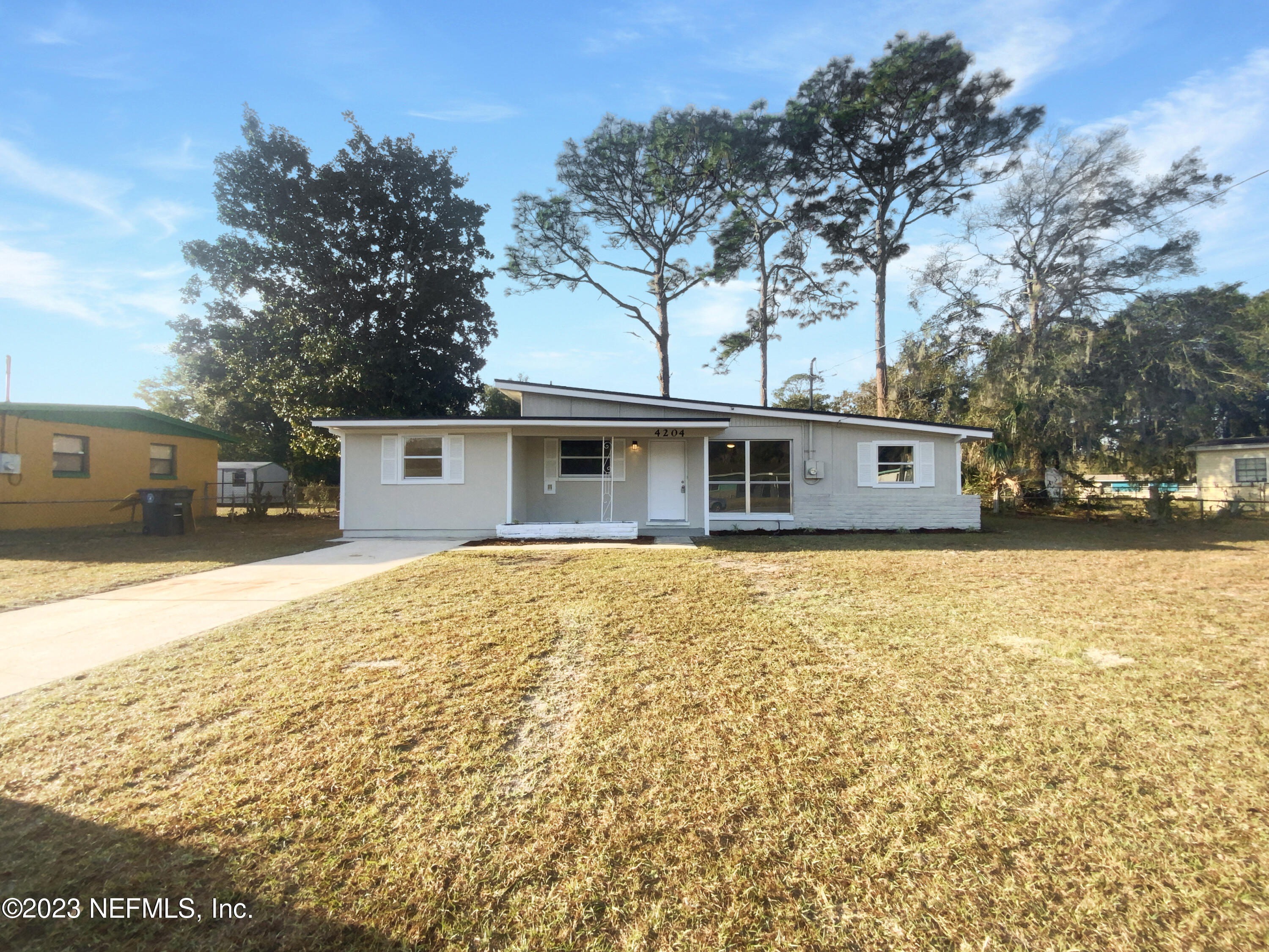 4204 Clyde Drive Jacksonville, FL 32208 - Photo 9 of 20 a front view of house with yard and trees