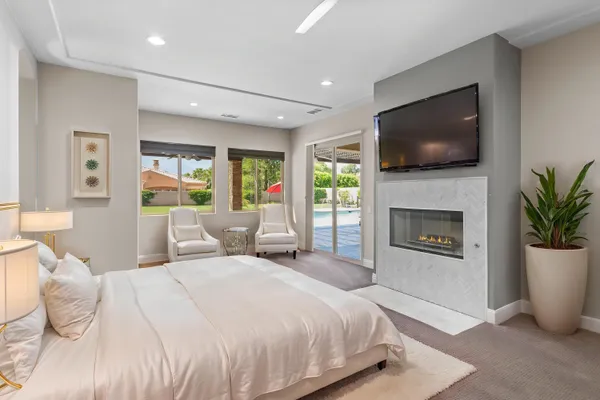an aerial view of a house with outdoor space patio and lake view