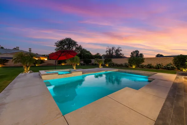 a view of a patio with couches table and chairs