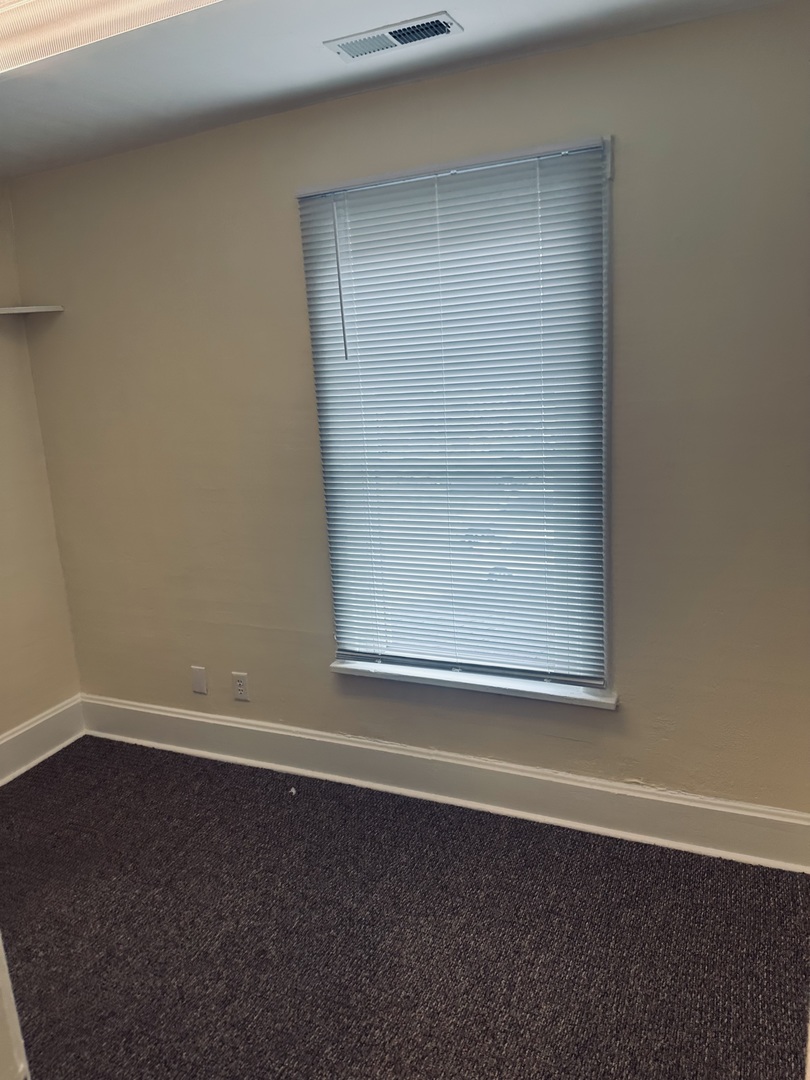 445 North Main Street, Unit 2 Sycamore, IL 60178 - Photo 3 of 11 an empty room with a window
