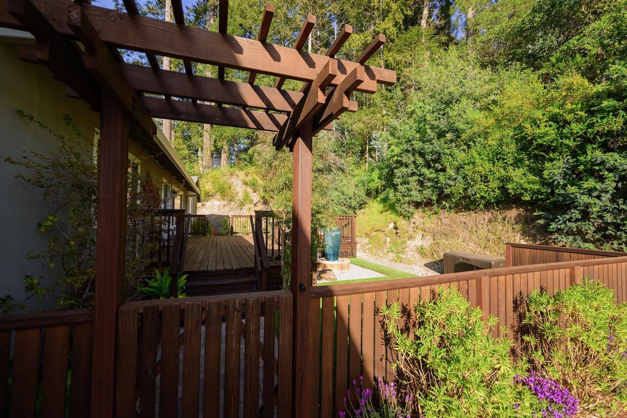145 Rabbits Run Road Santa Cruz, CA 95060 - Photo 110 of 120 a view of a pathway of a yard and wooden fence