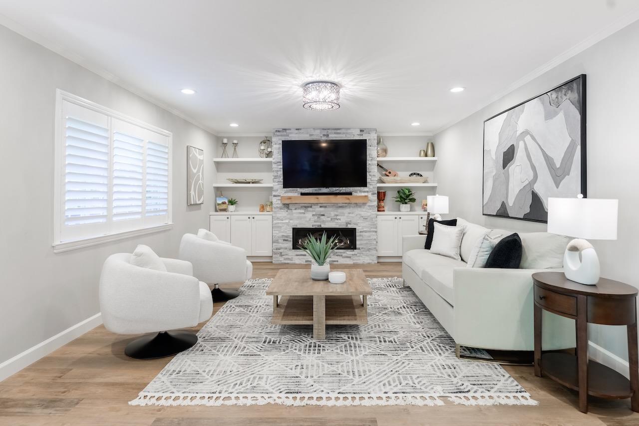 145 Rabbits Run Road Santa Cruz, CA 95060 - Photo 17 of 120 a living room with furniture a flat screen tv and a fireplace