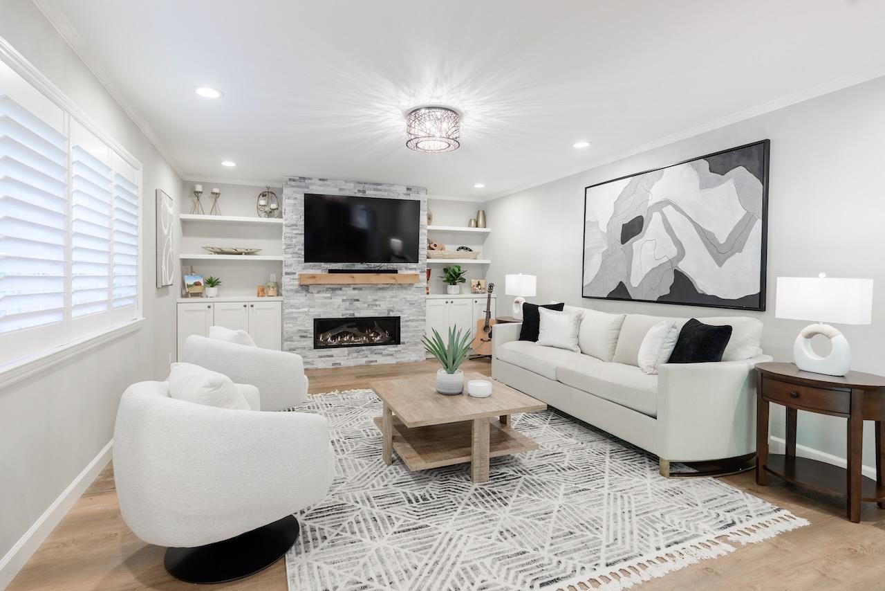 145 Rabbits Run Road Santa Cruz, CA 95060 - Photo 19 of 120 a living room with furniture a flat screen tv and a fireplace