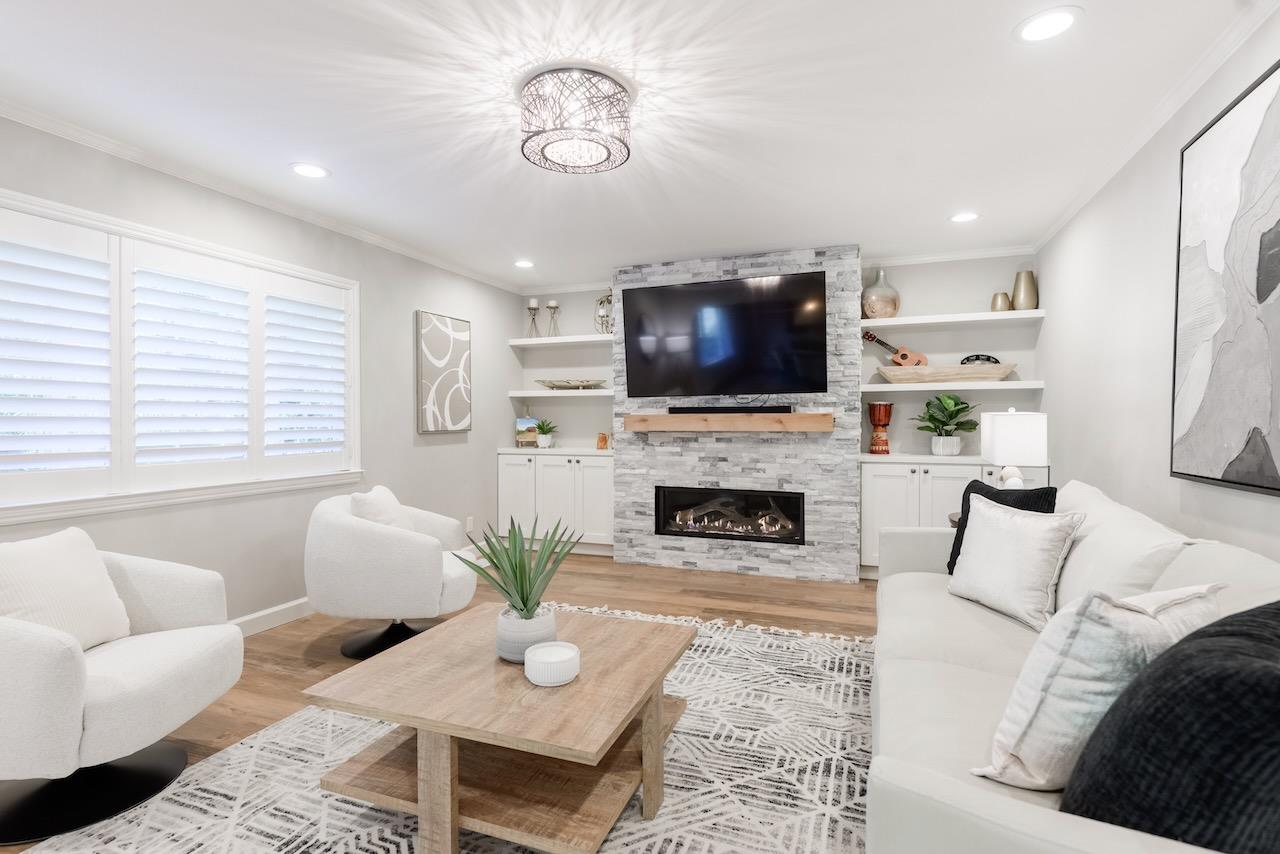 145 Rabbits Run Road Santa Cruz, CA 95060 - Photo 20 of 120 a living room with furniture a fireplace and a flat screen tv