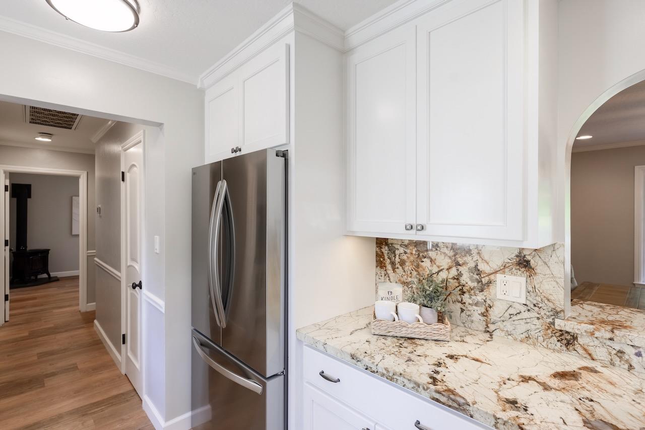 145 Rabbits Run Road Santa Cruz, CA 95060 - Photo 34 of 120 a kitchen with granite countertop a refrigerator and a sink