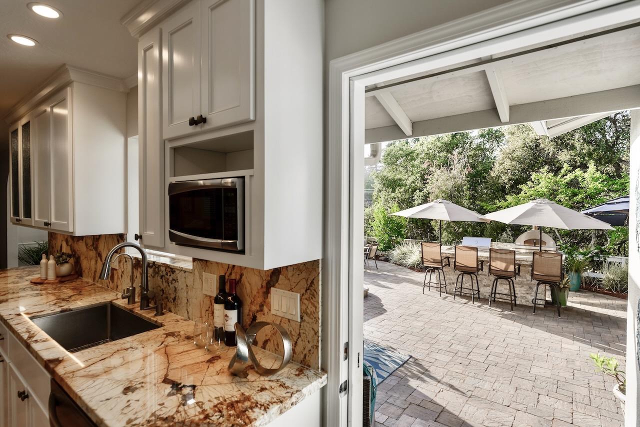 145 Rabbits Run Road Santa Cruz, CA 95060 - Photo 36 of 120 a kitchen with a sink and a large window