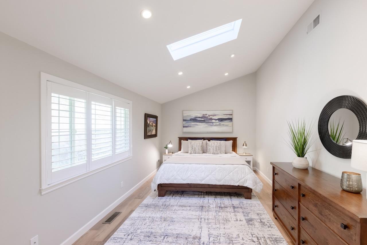 145 Rabbits Run Road Santa Cruz, CA 95060 - Photo 44 of 120 a bedroom with a large bed and a window