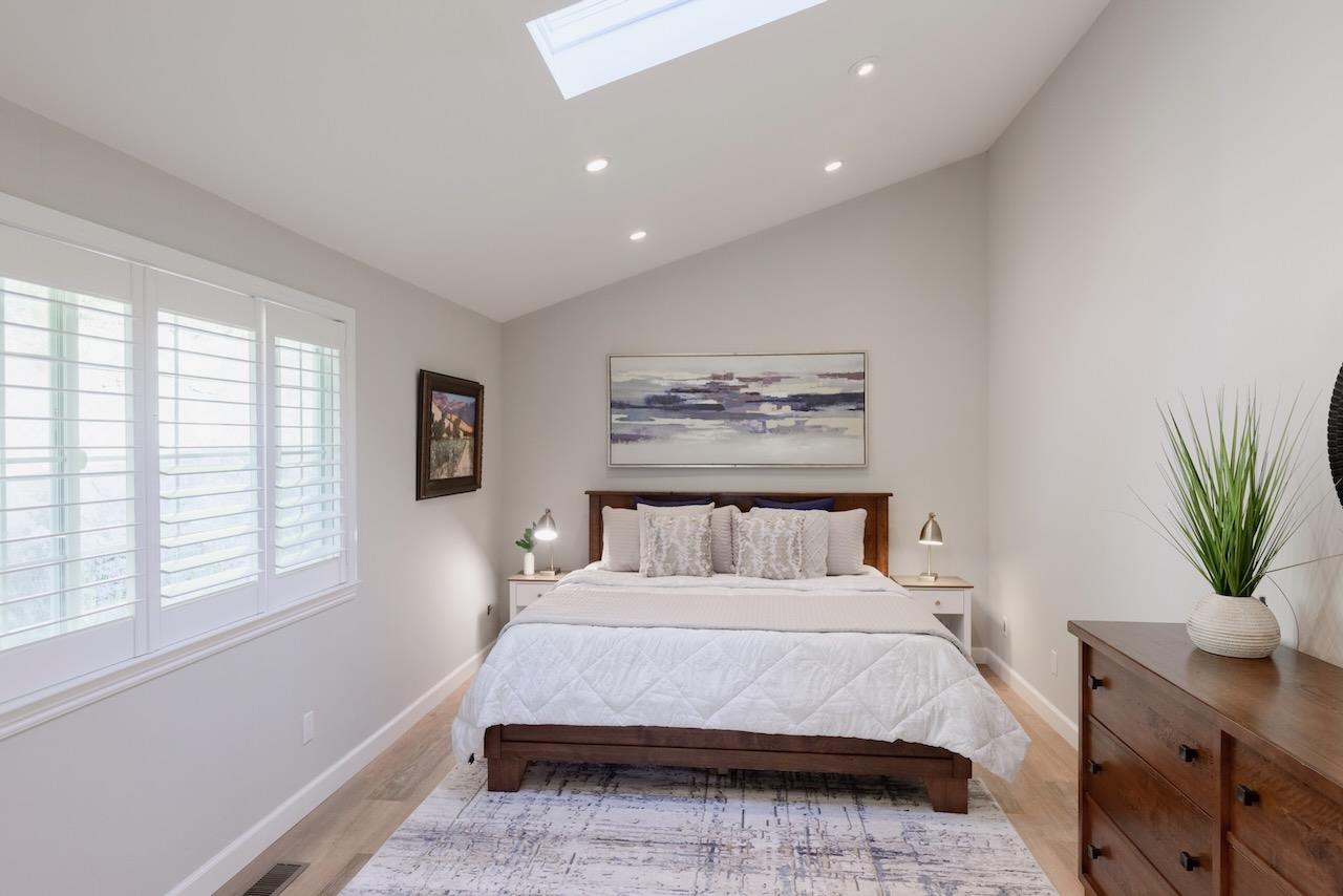 145 Rabbits Run Road Santa Cruz, CA 95060 - Photo 45 of 120 a bedroom with a large bed and a potted plant