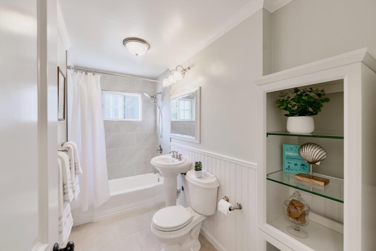 145 Rabbits Run Road Santa Cruz, CA 95060 - Photo 63 of 120 a white toilet sitting next to a bathroom sink and a shower