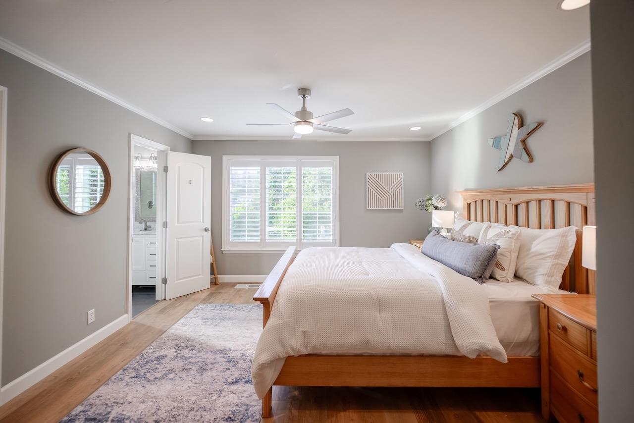 145 Rabbits Run Road Santa Cruz, CA 95060 - Photo 67 of 120 a spacious bedroom with a bed a mirror and a window