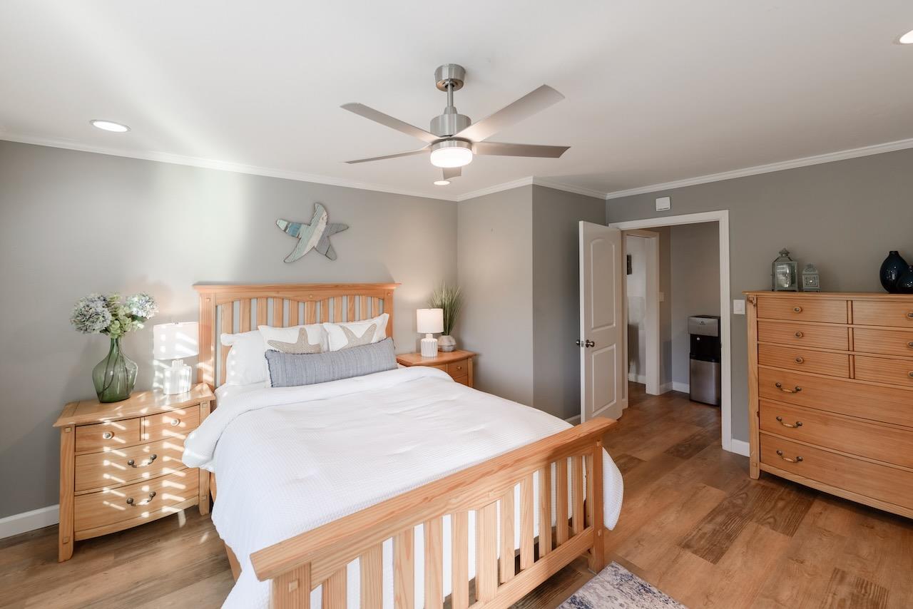 145 Rabbits Run Road Santa Cruz, CA 95060 - Photo 72 of 120 a bedroom with a bed and wooden floor