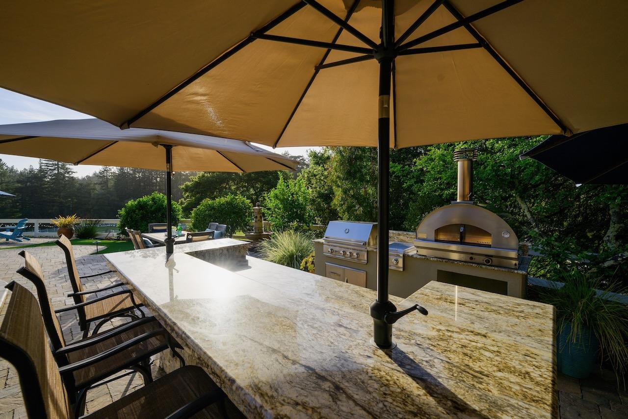 145 Rabbits Run Road Santa Cruz, CA 95060 - Photo 88 of 120 a view of a patio with a table and chairs under an umbrella