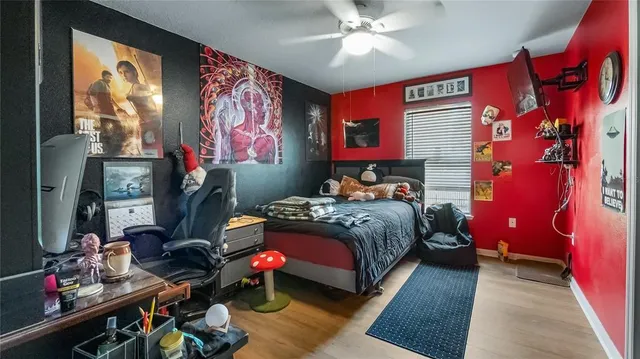 a bedroom with furniture and a chandelier
