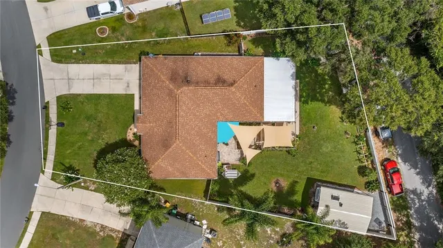 an aerial view of a house with a lake view
