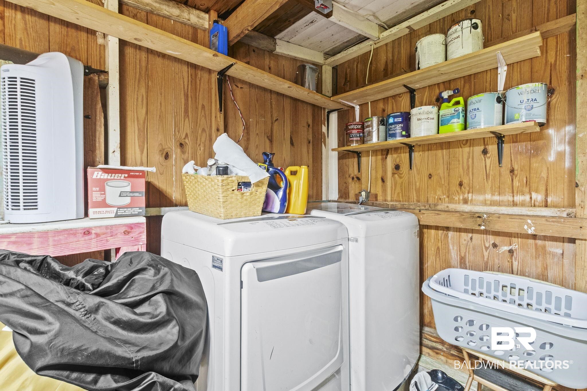 707 North Cedar Street Foley, AL 36535 - Photo 41 of 69 Laundry room featuring washing machine and clothes dryer, wood walls, and hardwood / wood-style floors