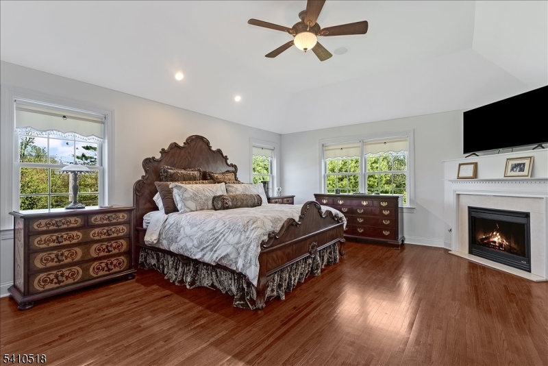 1 Brodziak Road Denville, NJ 07834 - Photo 15 of 42 a bed room with a bed and a fireplace