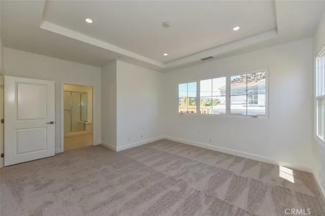 a view of an empty room and a window