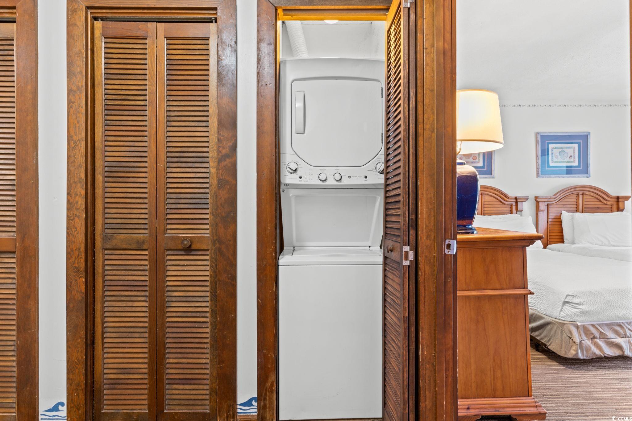 307 70th Avenue North, Unit 202 Myrtle Beach, SC 29572 - Photo 12 of 33 Laundry area with stacked washing machine and dryer