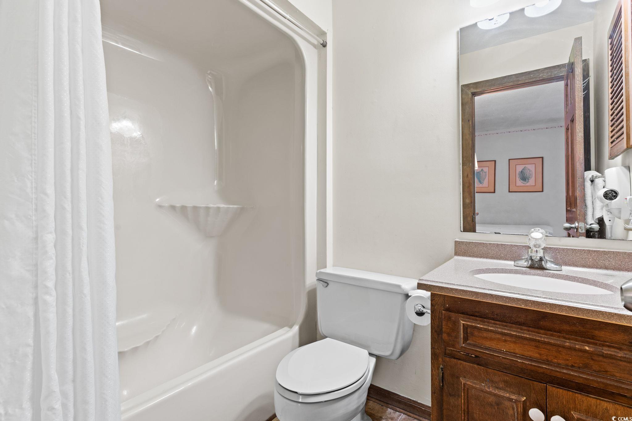 307 70th Avenue North, Unit 202 Myrtle Beach, SC 29572 - Photo 15 of 33 Bathroom with shower / bath combo and vanity
