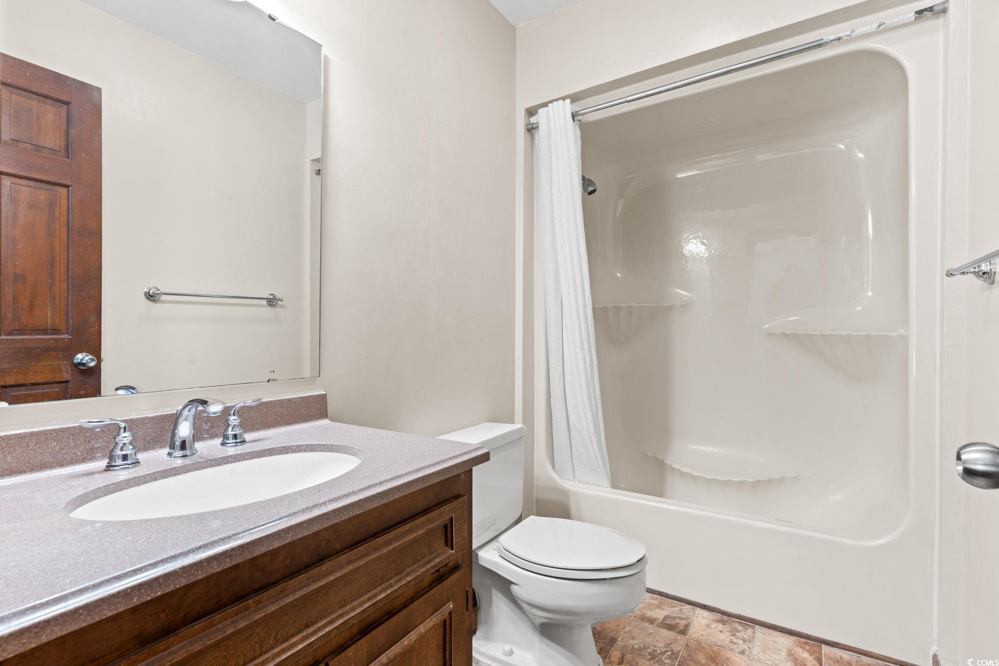307 70th Avenue North, Unit 202 Myrtle Beach, SC 29572 - Photo 7 of 33 Full bath featuring vanity and shower / bath combo