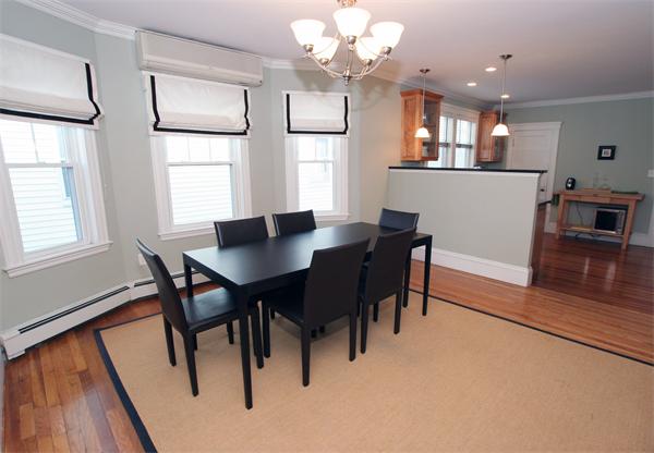 11 Roberts Road, Unit 2 Cambridge, MA 02138 - Photo 3 of 12 a view of a dining room with furniture and wooden floor