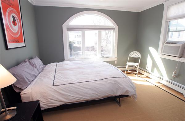 11 Roberts Road, Unit 2 Cambridge, MA 02138 - Photo 5 of 12 a bedroom with a bed and a large window