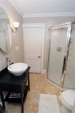 11 Roberts Road, Unit 2 Cambridge, MA 02138 - Photo 8 of 12 a bathroom with a sink a toilet a mirror and shower