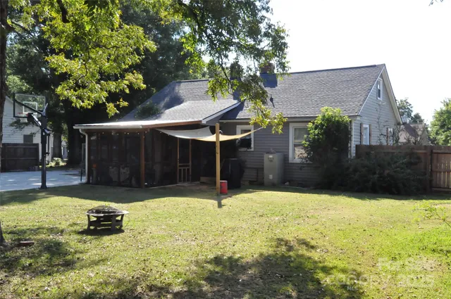 a backyard of a house with yard and garage