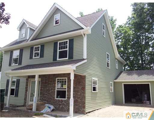 28 Idlewild Road Edison, NJ 08817 - Photo 1 of 10 a front view of a house with a yard