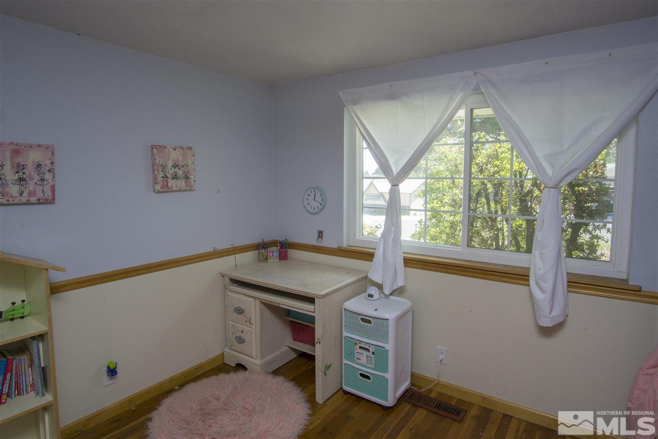 2245 West 6th Street Reno, NV 89503 - Photo 11 of 24 a room with a bed and a window