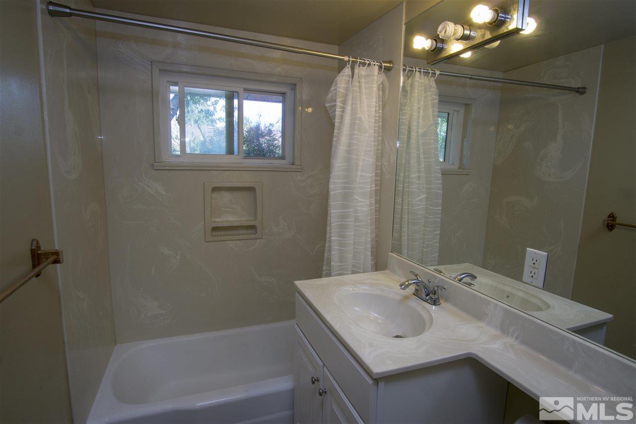 2245 West 6th Street Reno, NV 89503 - Photo 12 of 24 a bathroom with a sink toilet and shower
