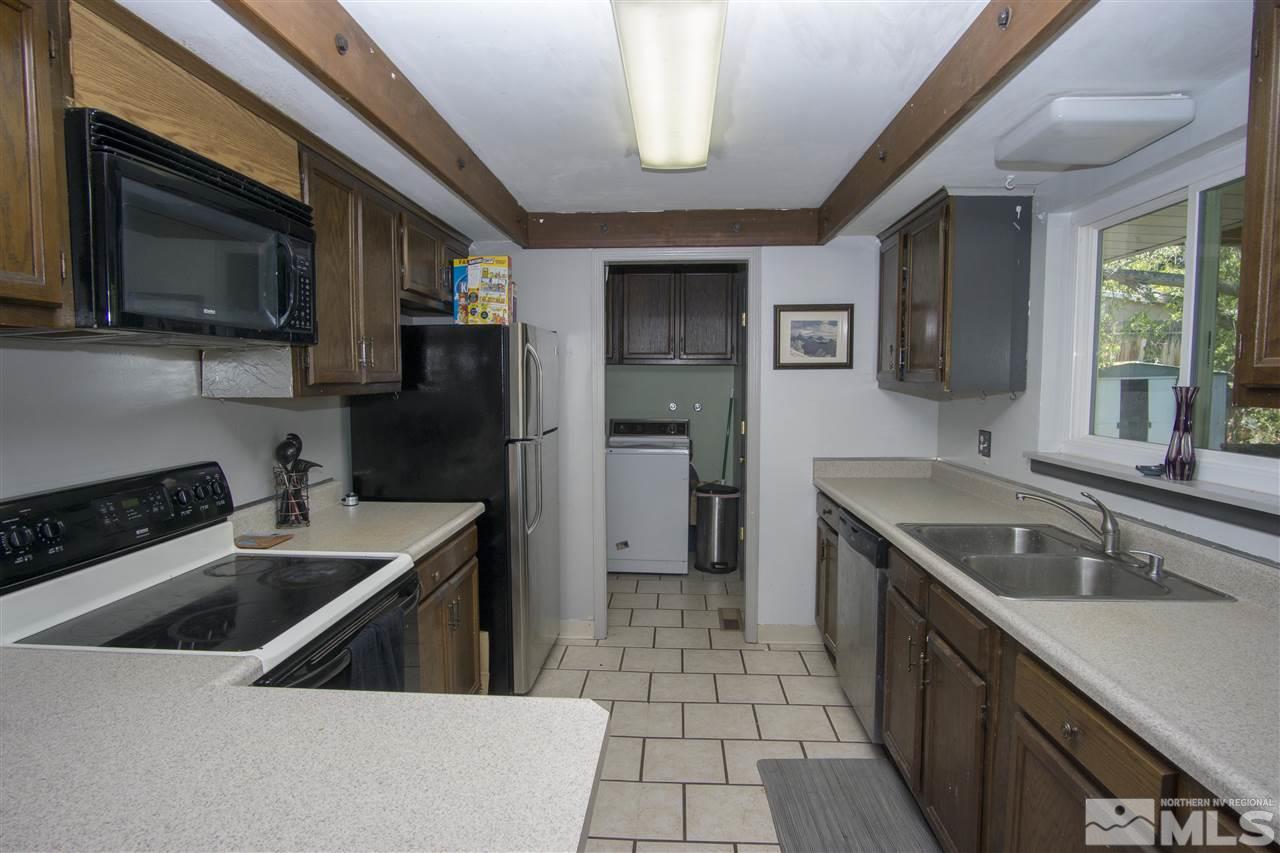 2245 West 6th Street Reno, NV 89503 - Photo 6 of 24 a kitchen that has a sink and a stove top oven