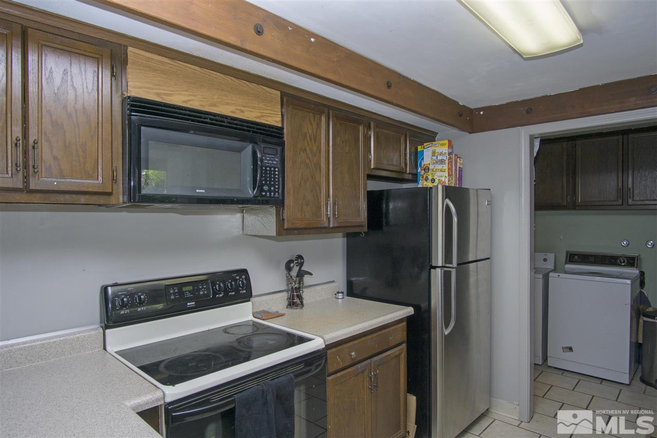 2245 West 6th Street Reno, NV 89503 - Photo 7 of 24 a kitchen with a refrigerator stove and microwave