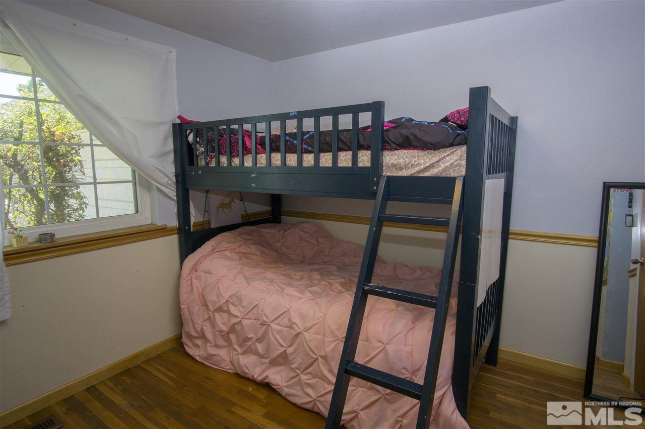 2245 West 6th Street Reno, NV 89503 - Photo 10 of 24 a bedroom with a bunk bed and a window