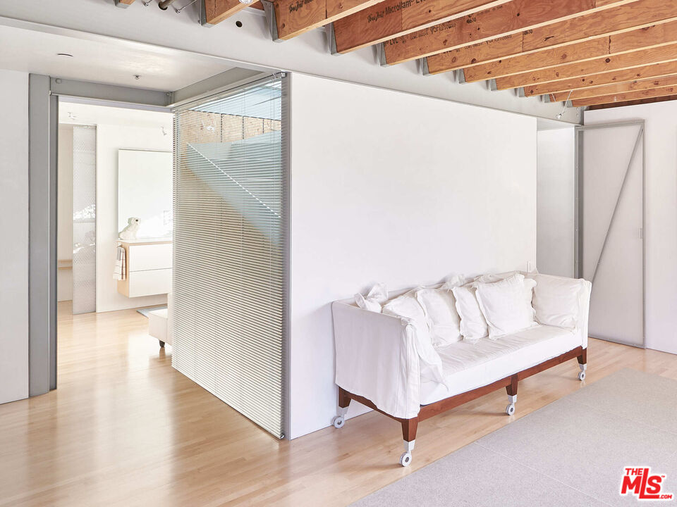 528 Grand Boulevard Venice, CA 90291 - Photo 13 of 17 a spacious bedroom with a bed and a rug