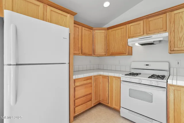 a view of storage and utility room with washer and dryer