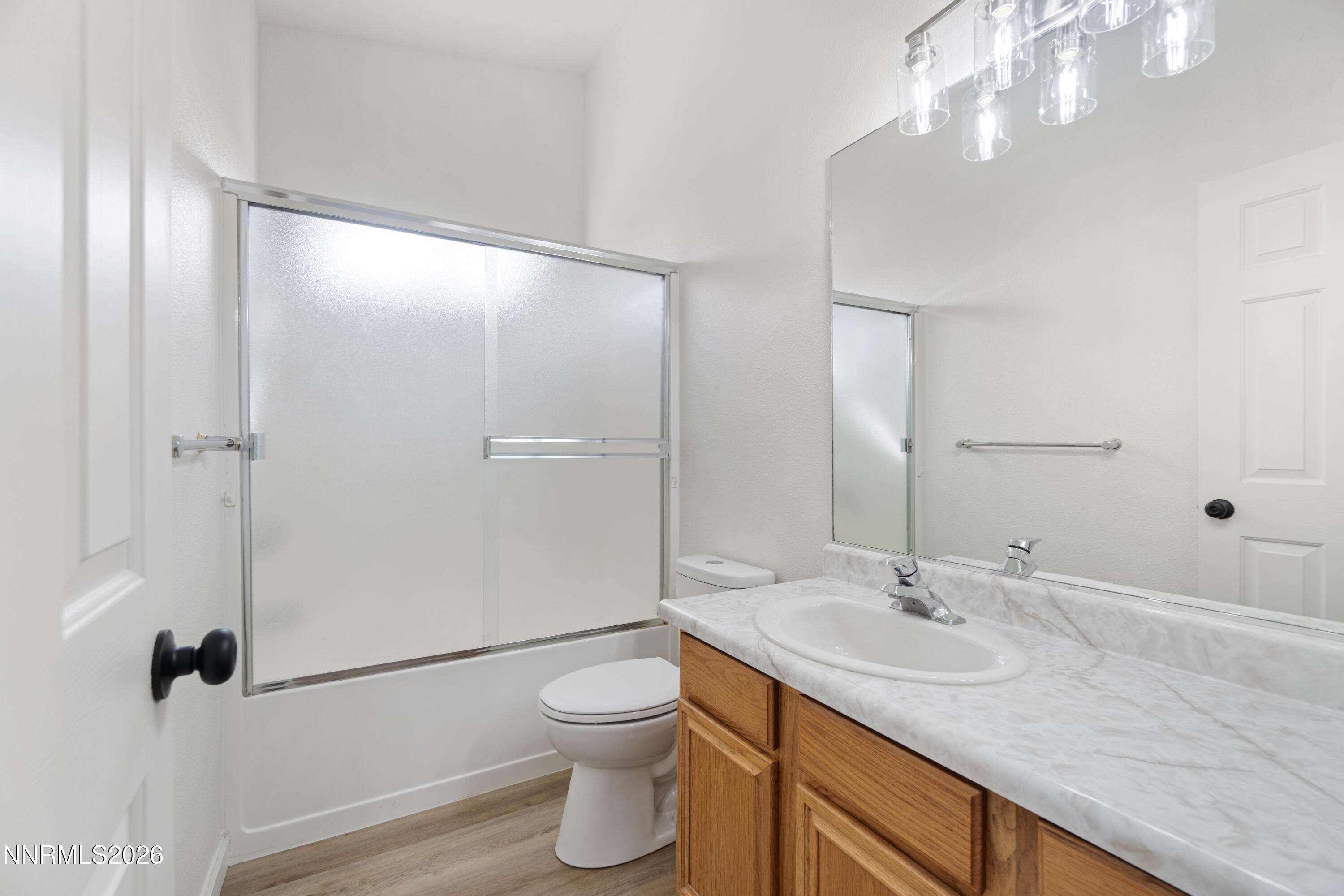 4015 Raven Drive Fallon, NV 89406 - Photo 19 of 29 a bathroom with a granite countertop sink a toilet and shower