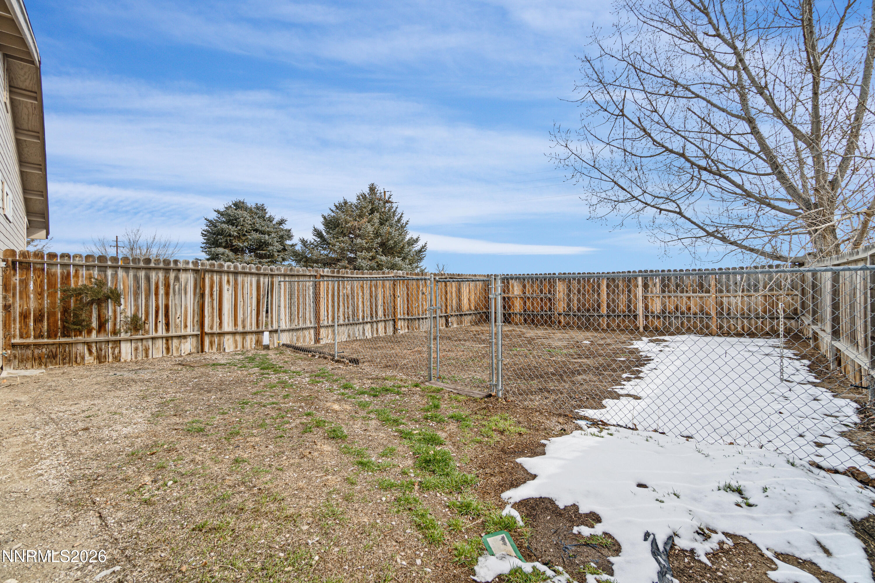 4015 Raven Drive Fallon, NV 89406 - Photo 28 of 29 a view of a backyard with wooden fence