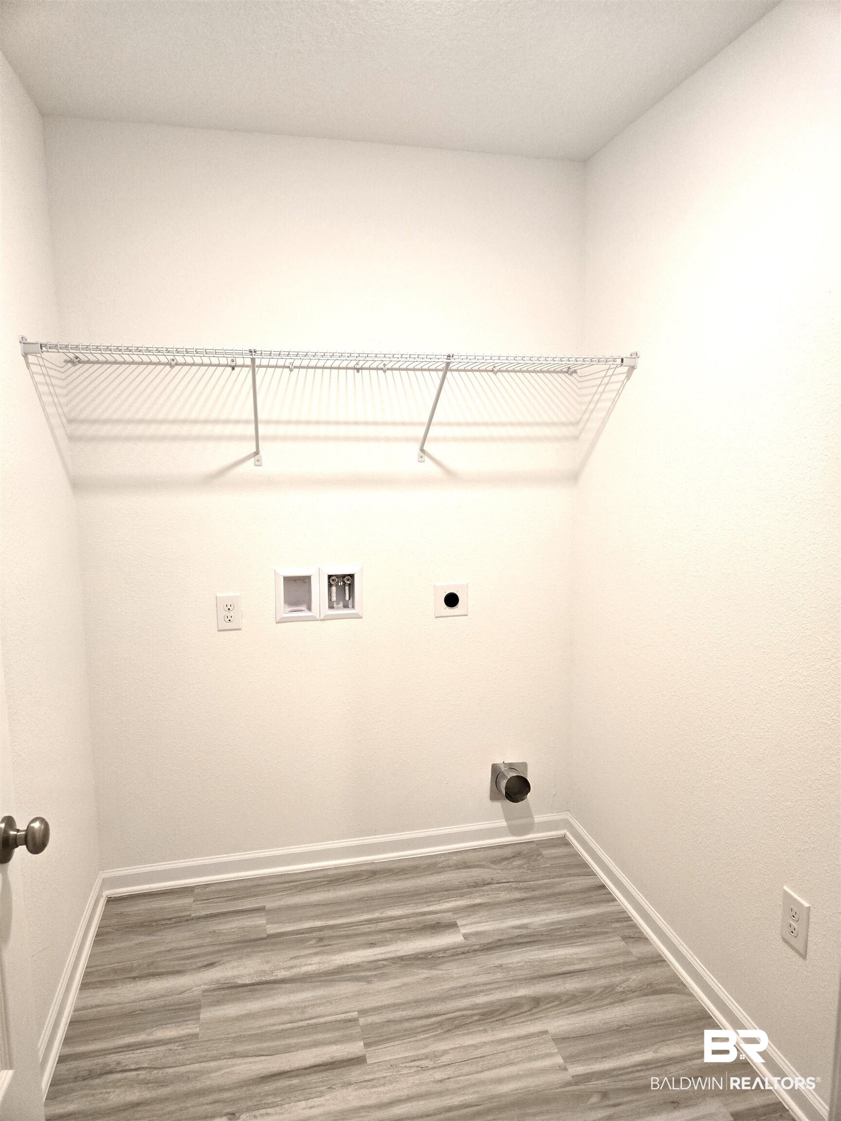 24385 Ringneck Loop Elberta, AL 36530 - Photo 18 of 33 Washroom with hookup for a washing machine, wood-type flooring, and hookup for an electric dryer