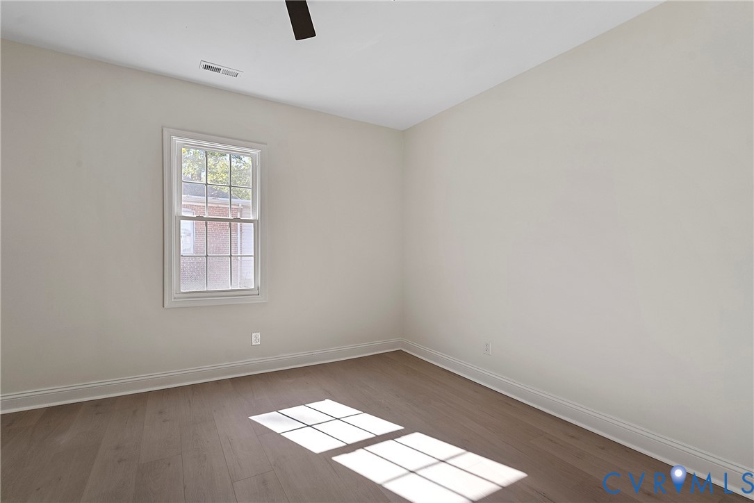 3601 Decatur Street Richmond, VA 23224 - Photo 28 of 35 Spare room with dark wood-style floors and ceiling
