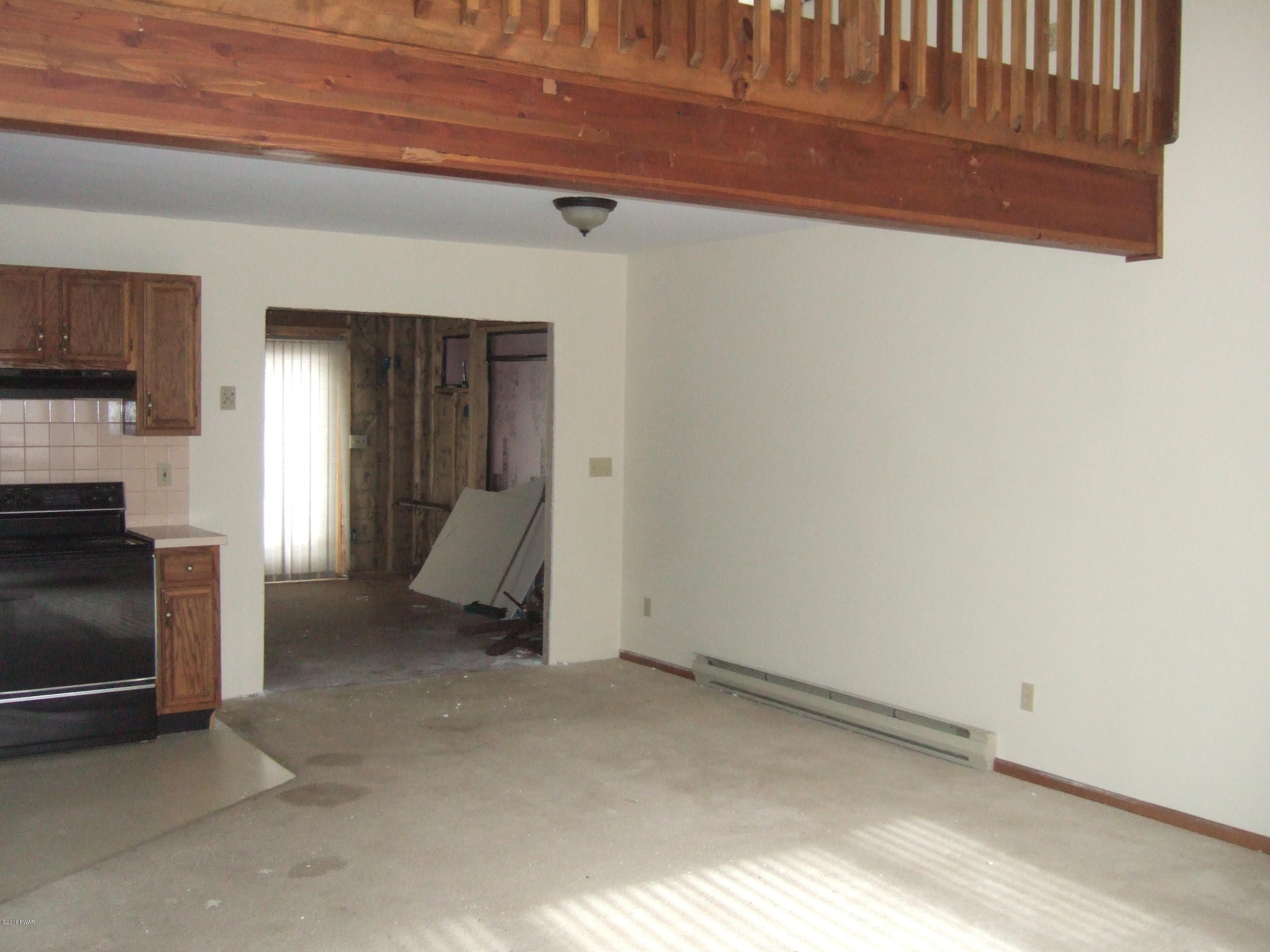 2654 Boulder Road Lake Ariel, PA 18436 - Photo 6 of 40 a view of empty room with wooden floor and fireplace