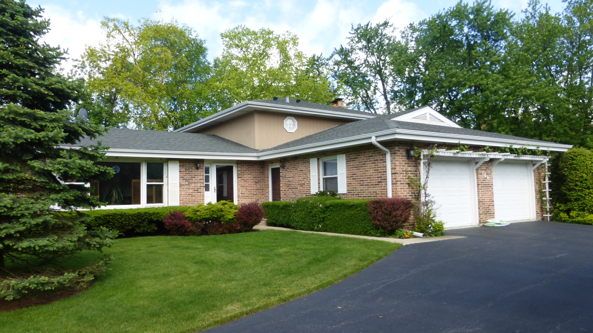 100 Ela Road Inverness, IL 60067 - Photo 1 of 25 a front view of a house with a yard and garage