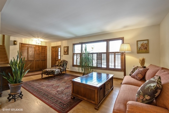 100 Ela Road Inverness, IL 60067 - Photo 4 of 25 a living room with furniture floor to ceiling window and potted plant