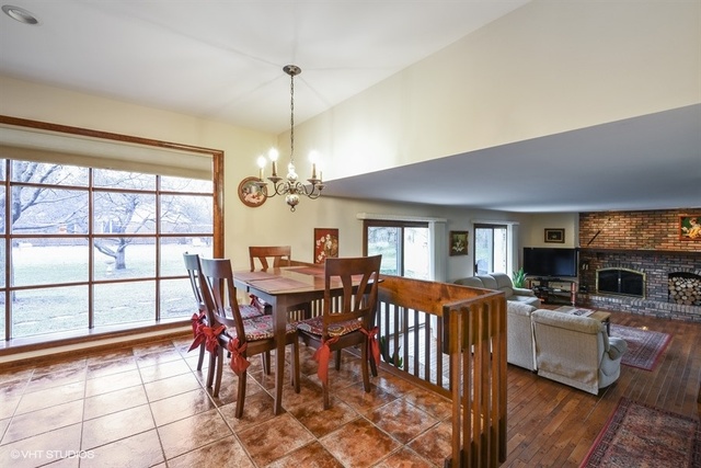 100 Ela Road Inverness, IL 60067 - Photo 7 of 25 a view of a dining room with furniture window and wooden floor