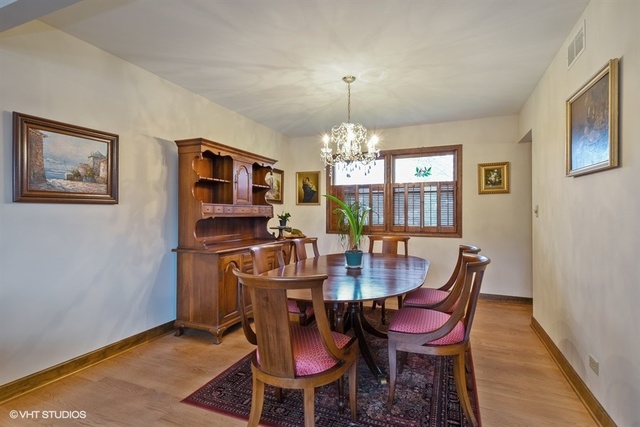 100 Ela Road Inverness, IL 60067 - Photo 9 of 25 a view of a dining room with furniture