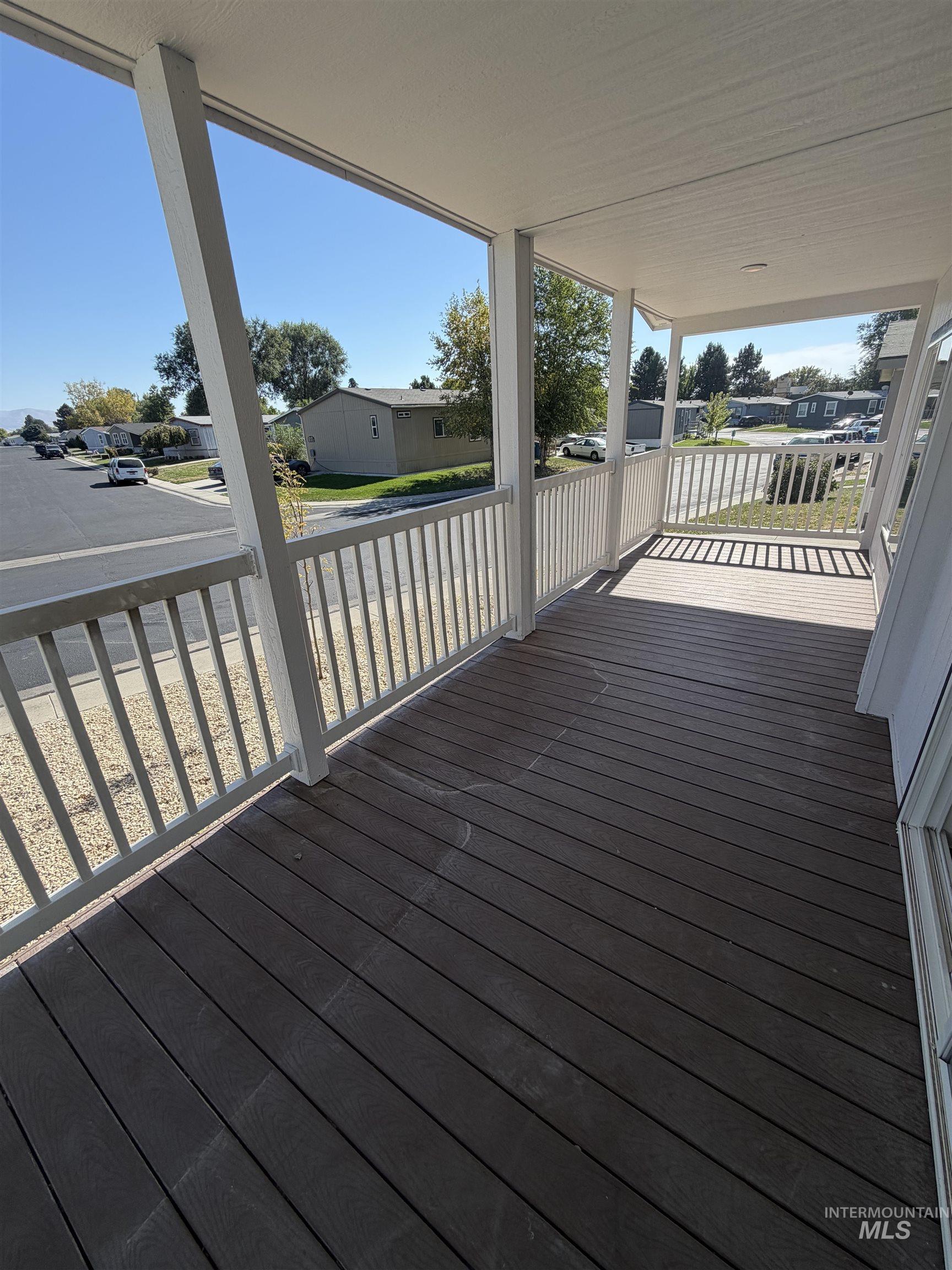 611 North Timathy Road Boise, ID 83713 - Photo 27 of 28 Covered porch with composite decking and white railings