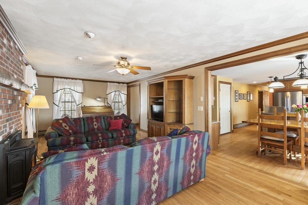 162 South Shore Road Burrillville, RI 02859 - Photo 14 of 39 a bedroom with furniture and a wooden floor