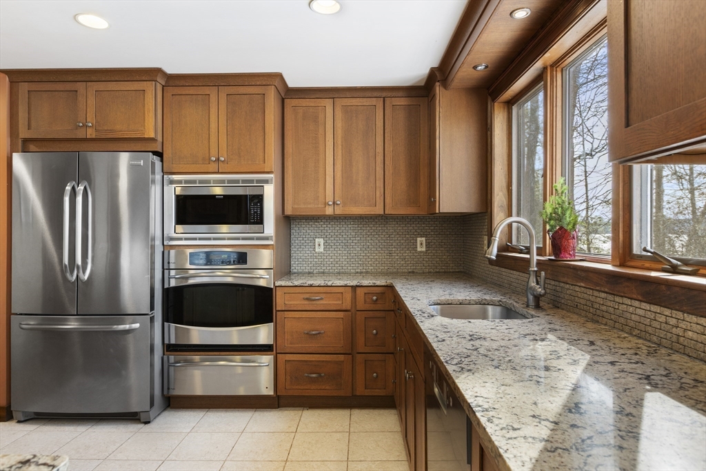 162 South Shore Road Burrillville, RI 02859 - Photo 17 of 39 a kitchen with stainless steel appliances granite countertop a refrigerator sink and stove