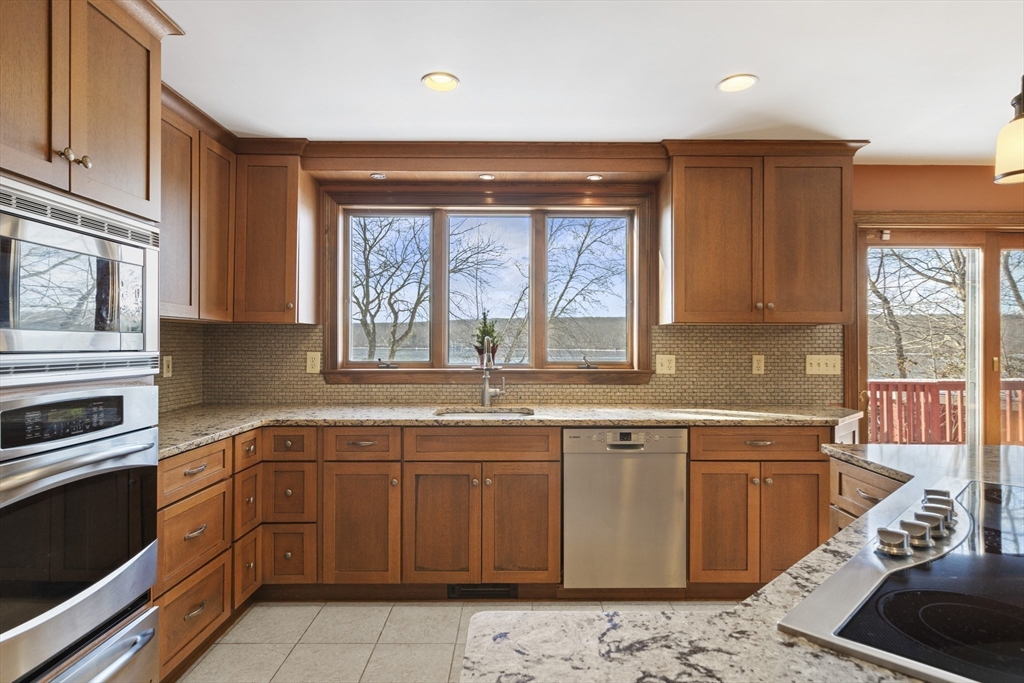 162 South Shore Road Burrillville, RI 02859 - Photo 18 of 39 a kitchen with a sink stove and cabinets